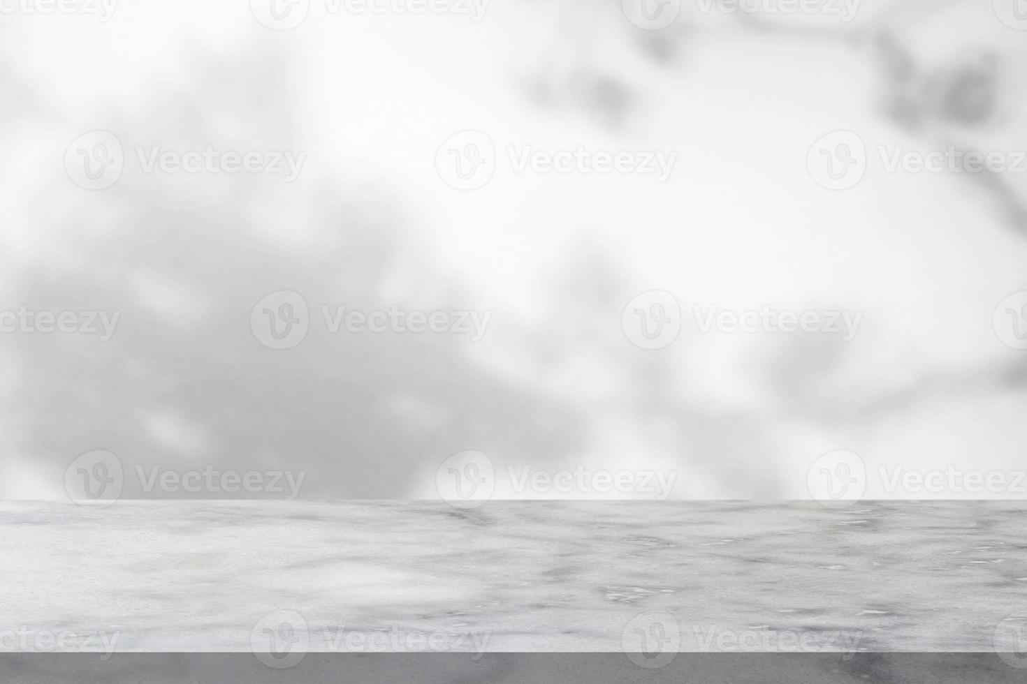 Marble table with tree shadow drop on white wall background for mockup product display photo