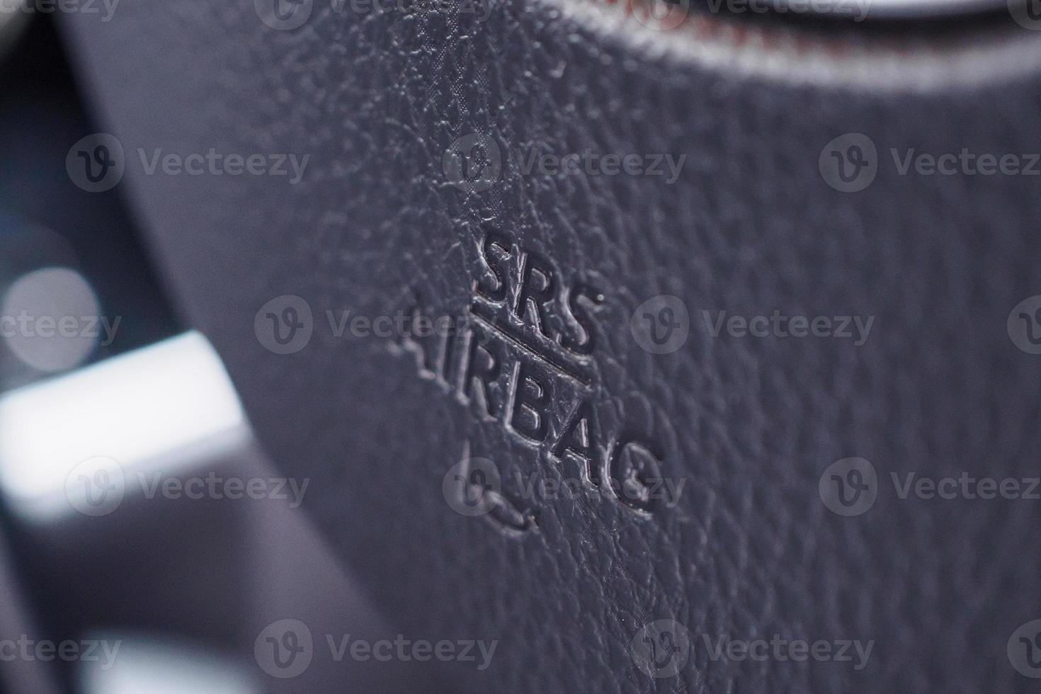 Safety airbag sign on car steering wheel with horn icon photo