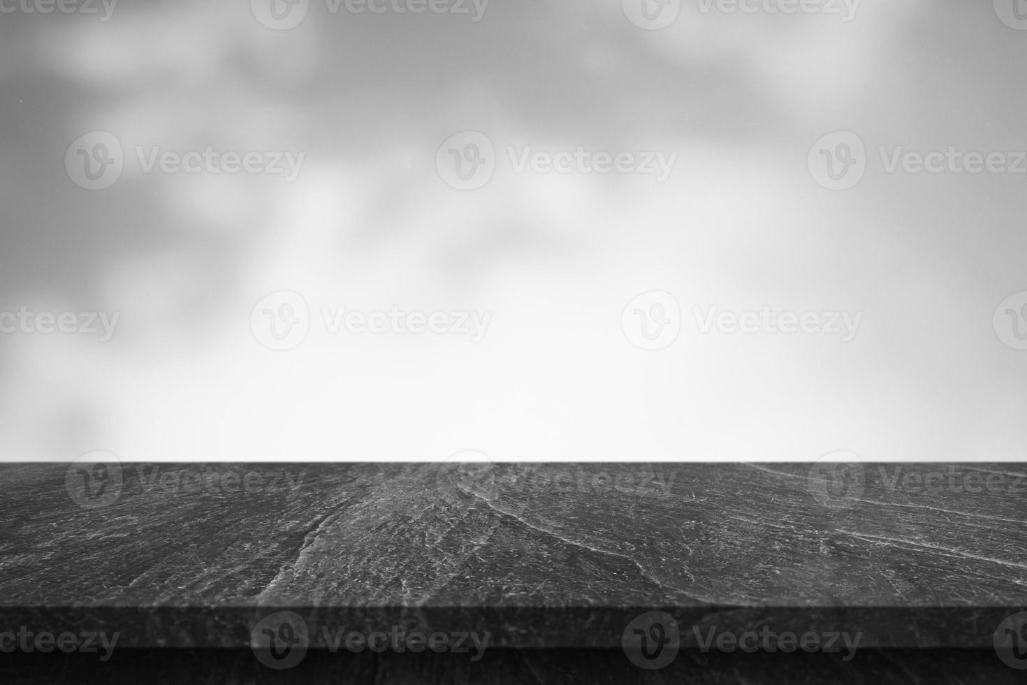 Marble table with tree shadow drop on white wall background for mockup product display photo