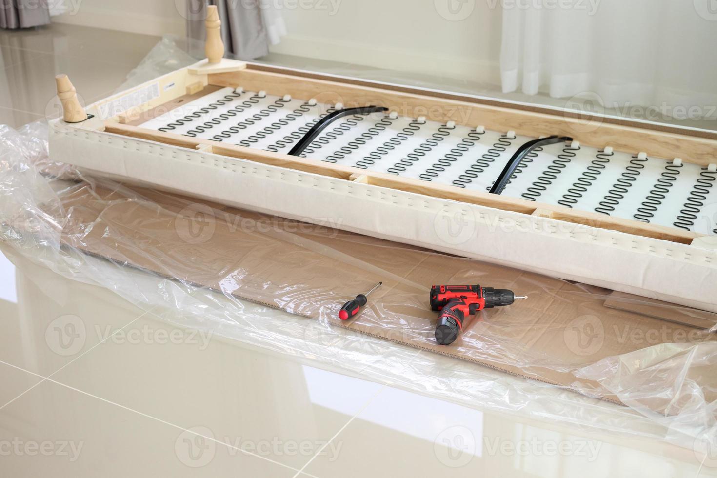 assembling sofa furniture at home with cordless screwdriver photo