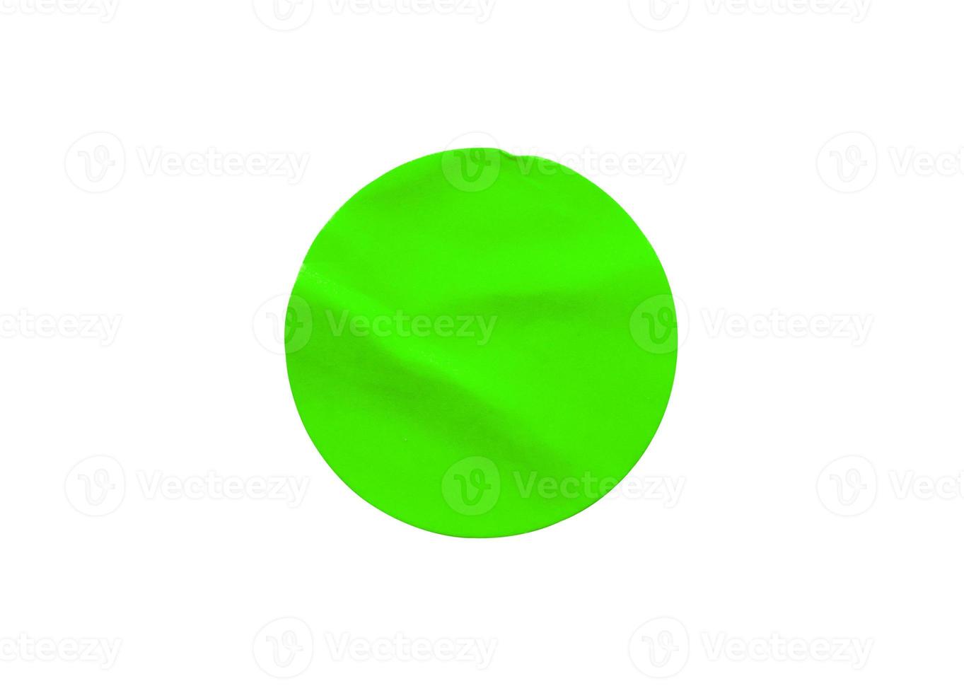 Green round paper sticker label isolated on white background photo