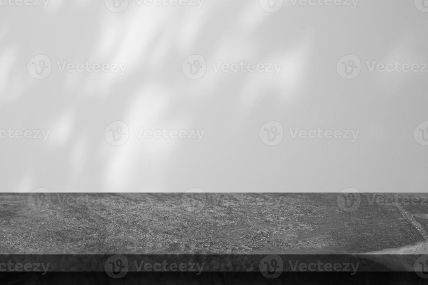 Marble table with tree shadow drop on white wall background for mockup product display photo