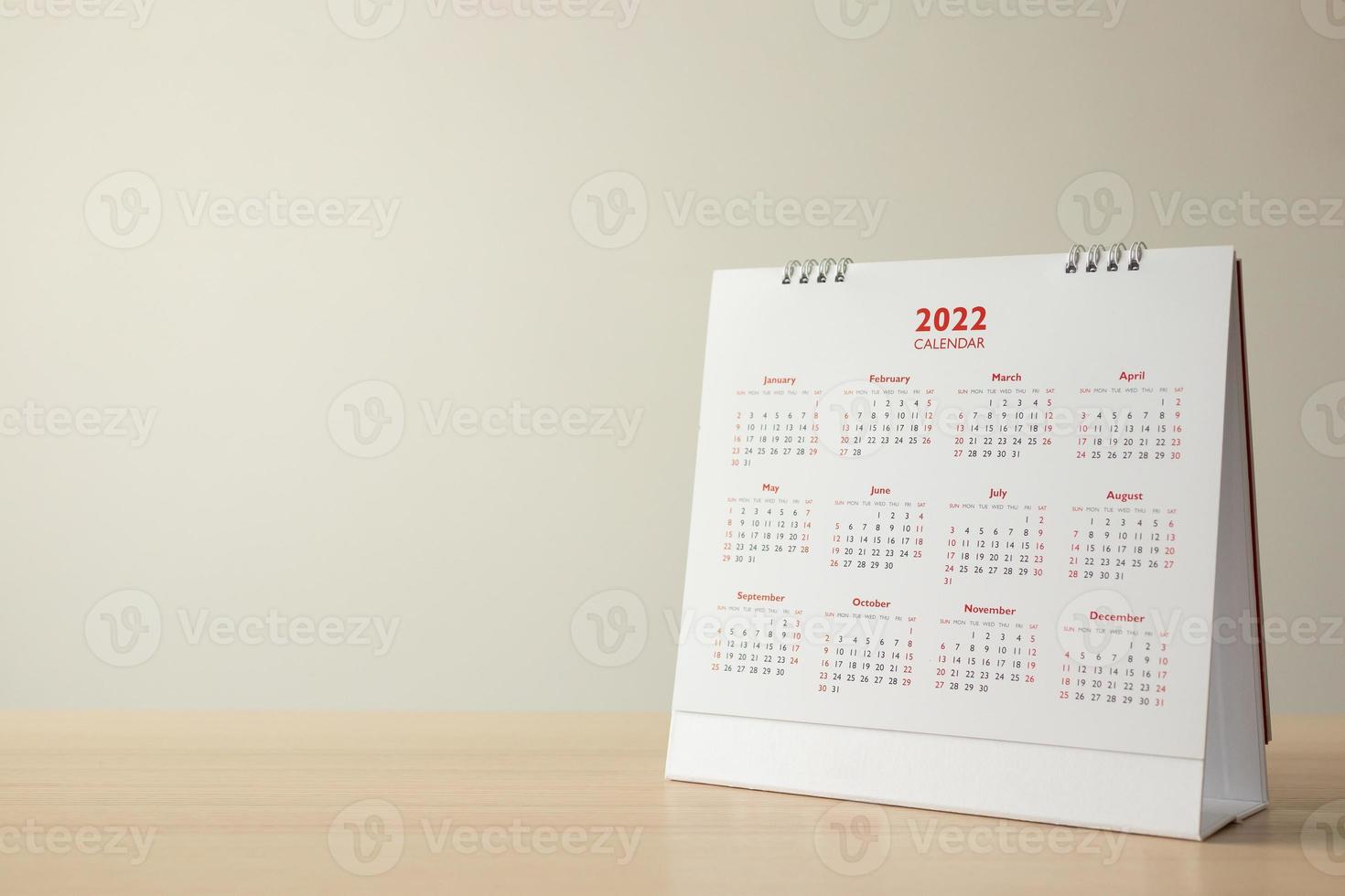 Close up 2022 calendar page dates and month background business planning appointment meeting concept photo