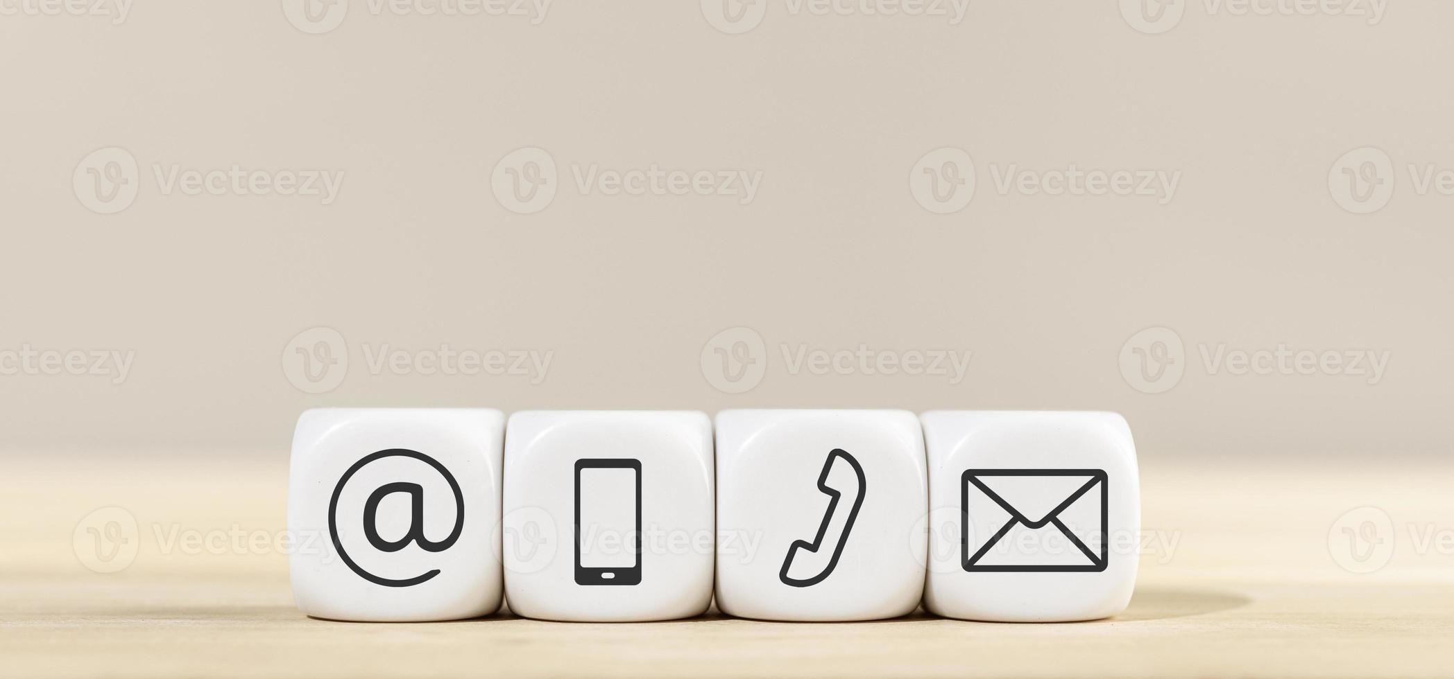 Contact us icons on white cube blocks photo