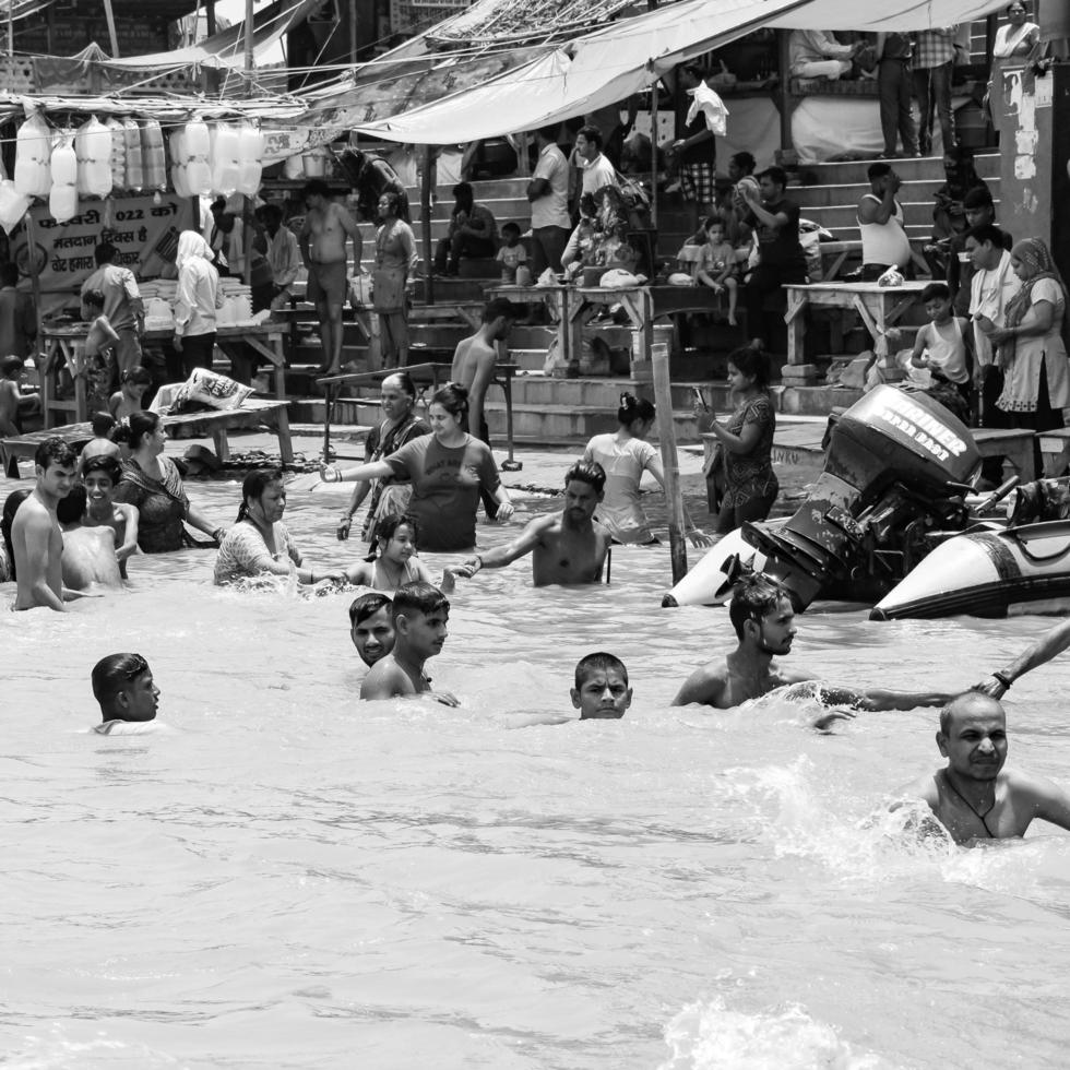 Garh Mukteshwar, UP, India, June 11 2022 -People are taking holy dip on the occasion of Nirjala Ekadashi, A view of Garh Ganga Brij ghat which is very famous religious place for Hindus-Black and White photo