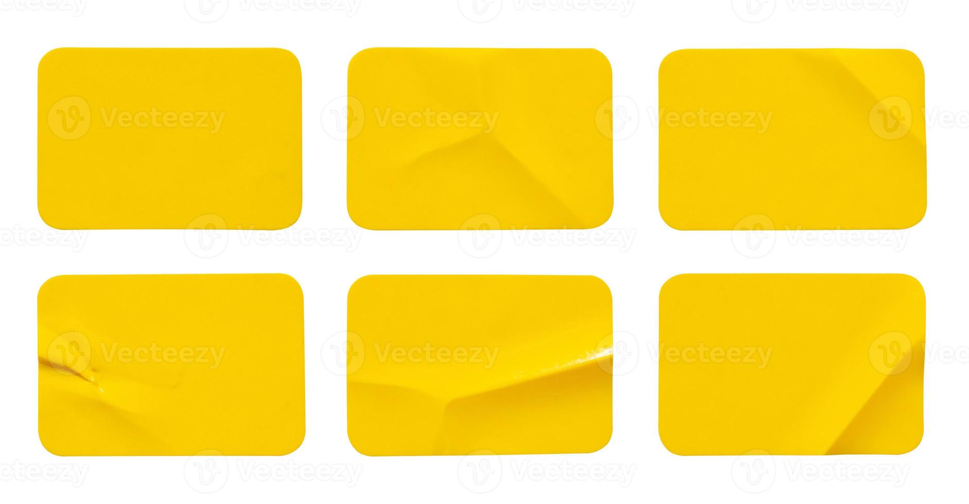 Yellow plastic sticker label isolated on white background photo