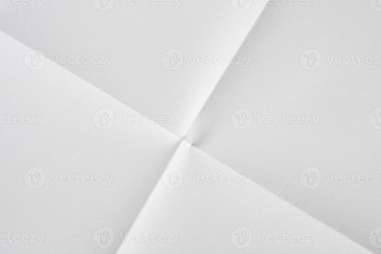 White folded and wrinkled paper texture background photo