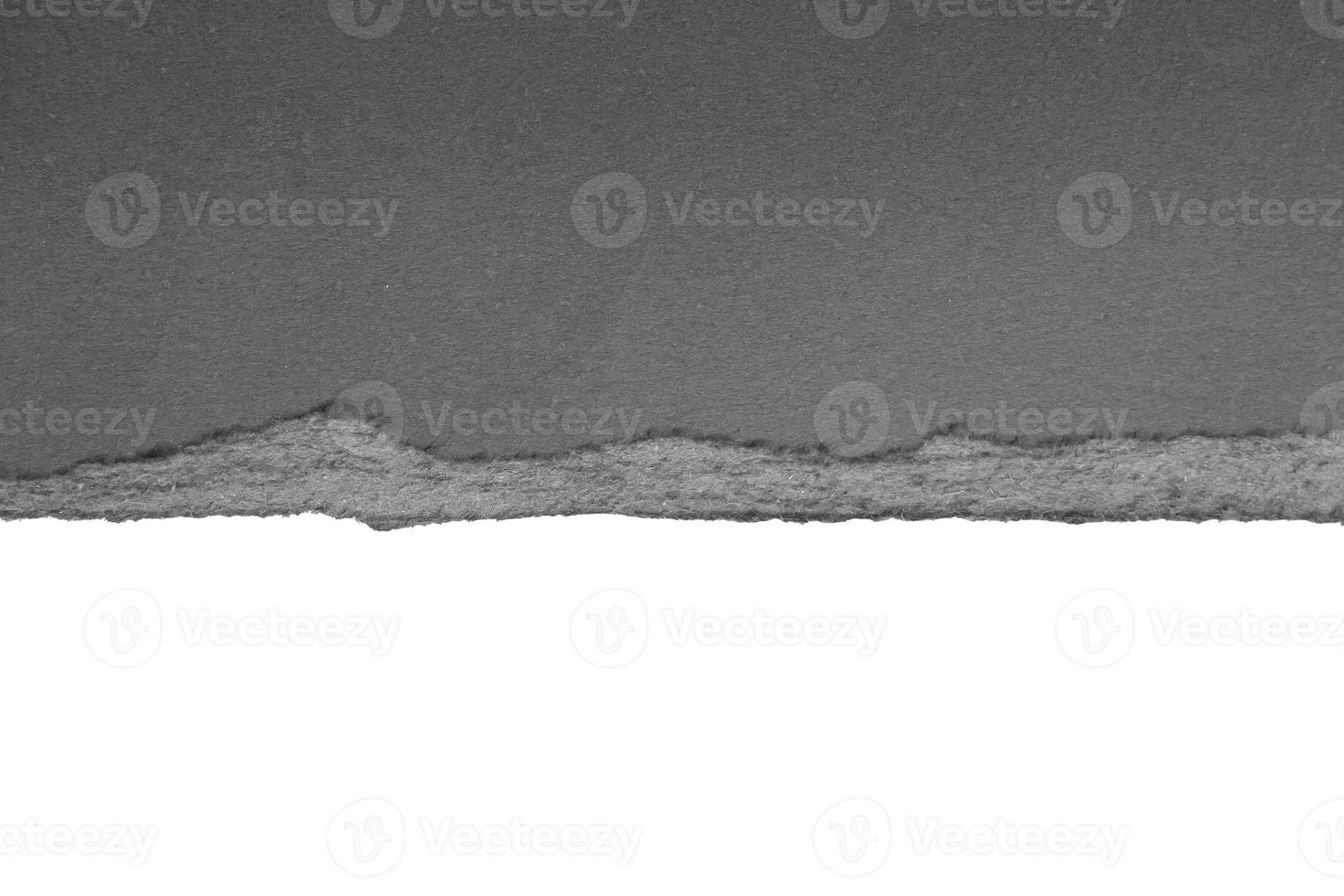 Black ripped paper torn edges strips isolated on white background photo