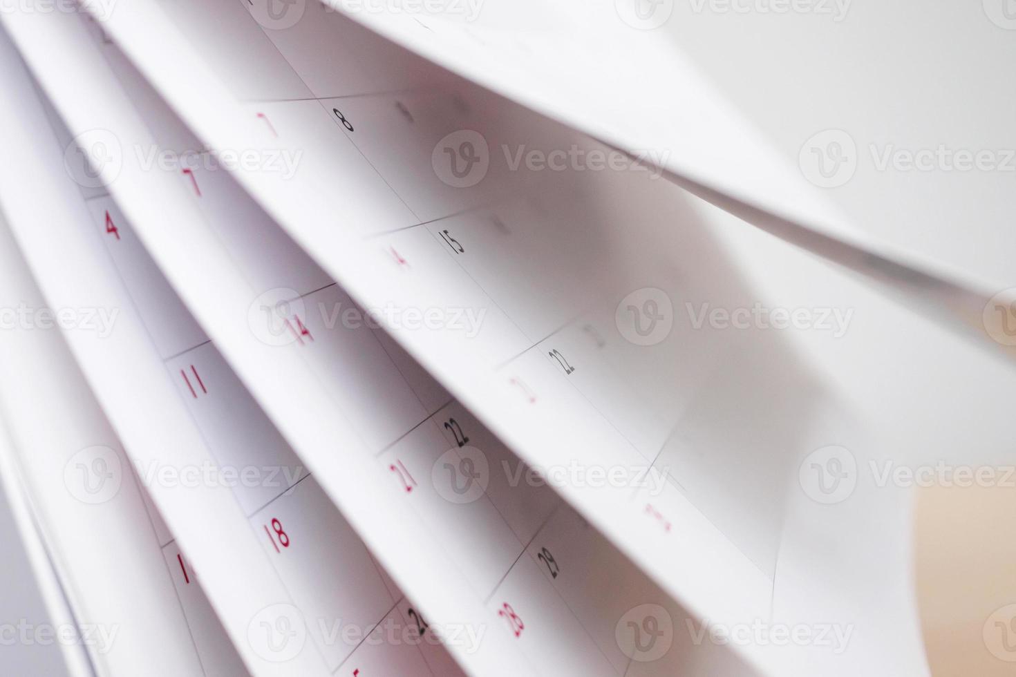 Calendar page flipping sheet close up blur background business schedule planning appointment meeting concept photo