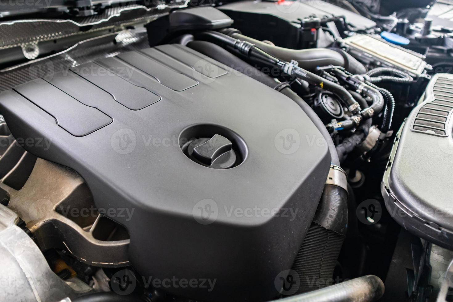 modern car engine under hood close up detail photo