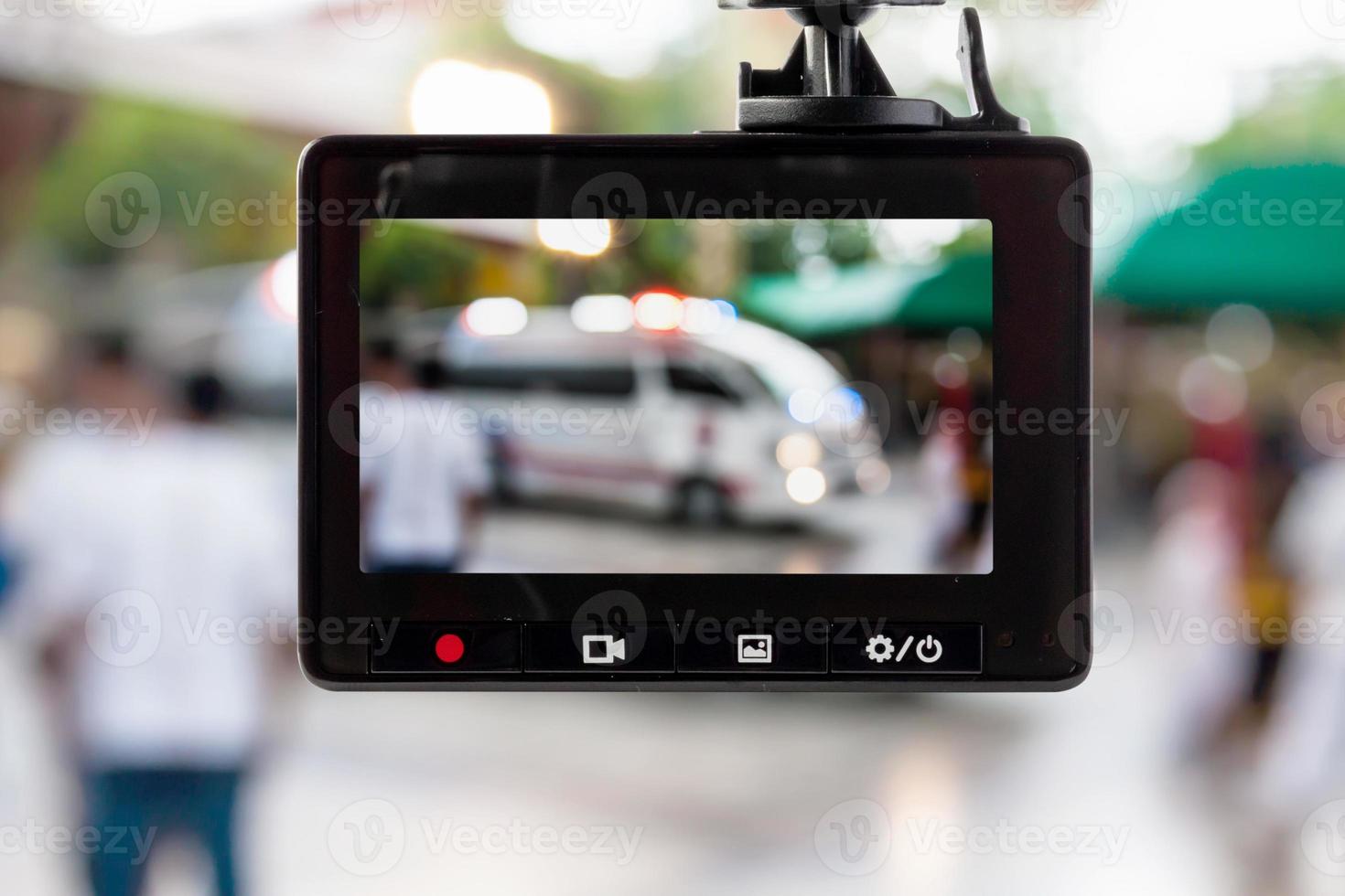 Car CCTV camera video recorder with ambulance car on the road photo