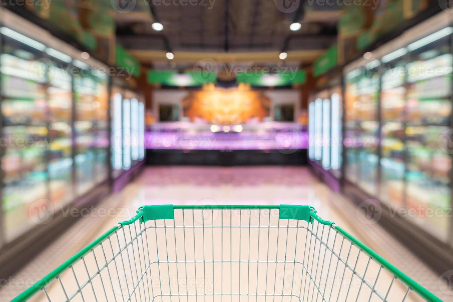 empty shopping cart in supermarket grocery store background photo