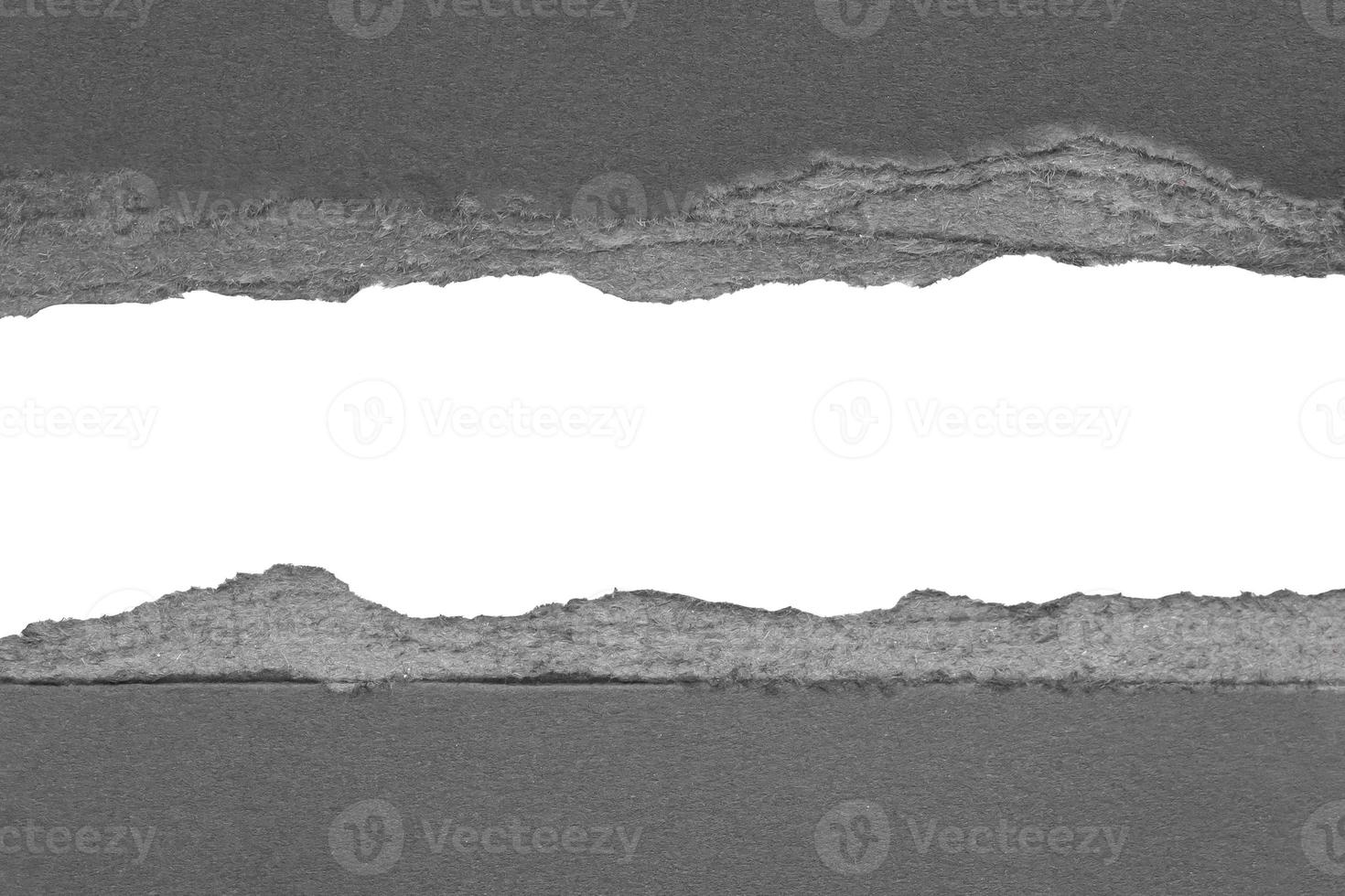 Black ripped paper torn edges strips isolated on white background photo