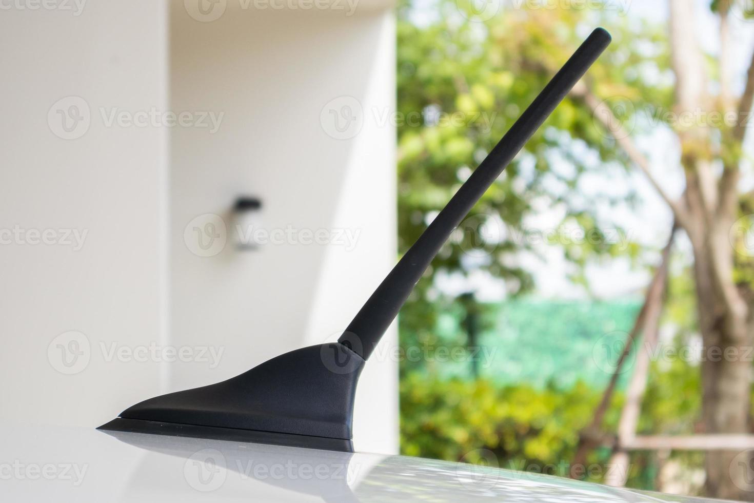 car radio antenna on the car roof photo