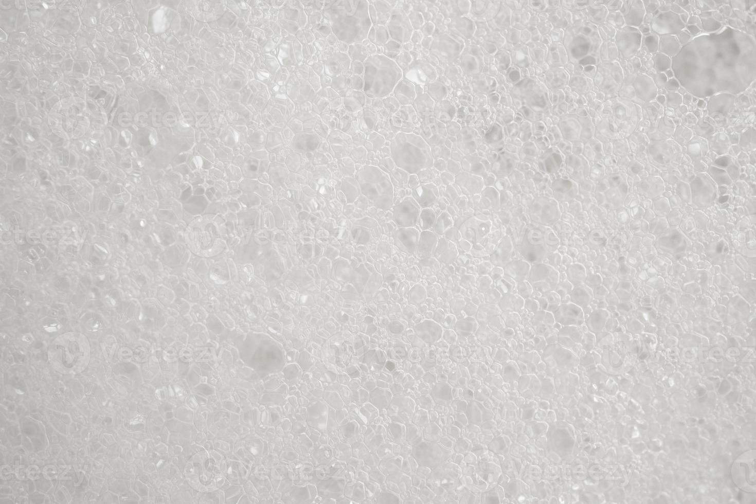 Abstract white soap foam texture background close up photo