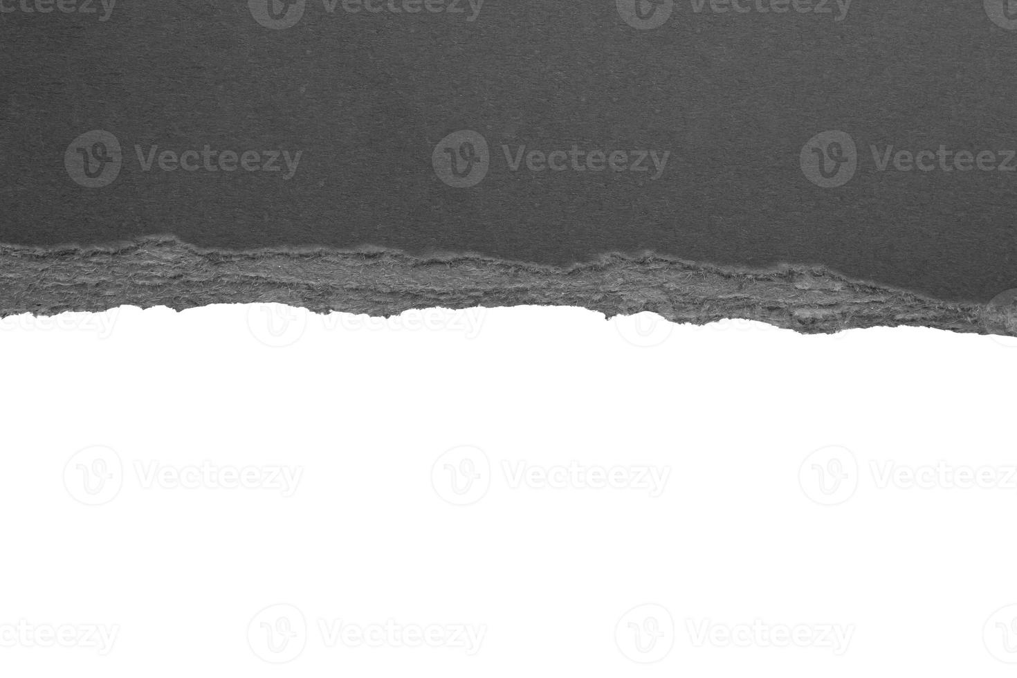 Black ripped paper torn edges strips isolated on white background photo