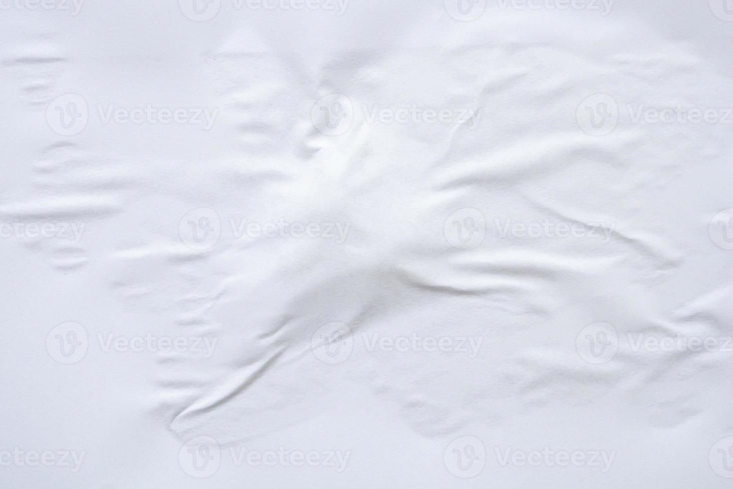 white crumpled and creased paper poster texture background photo