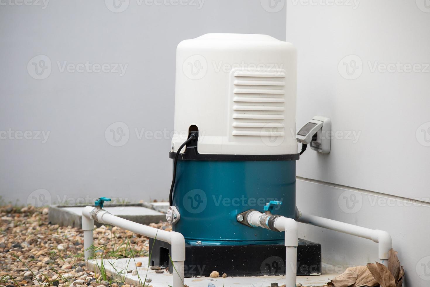 automatic water pump station outside the house photo