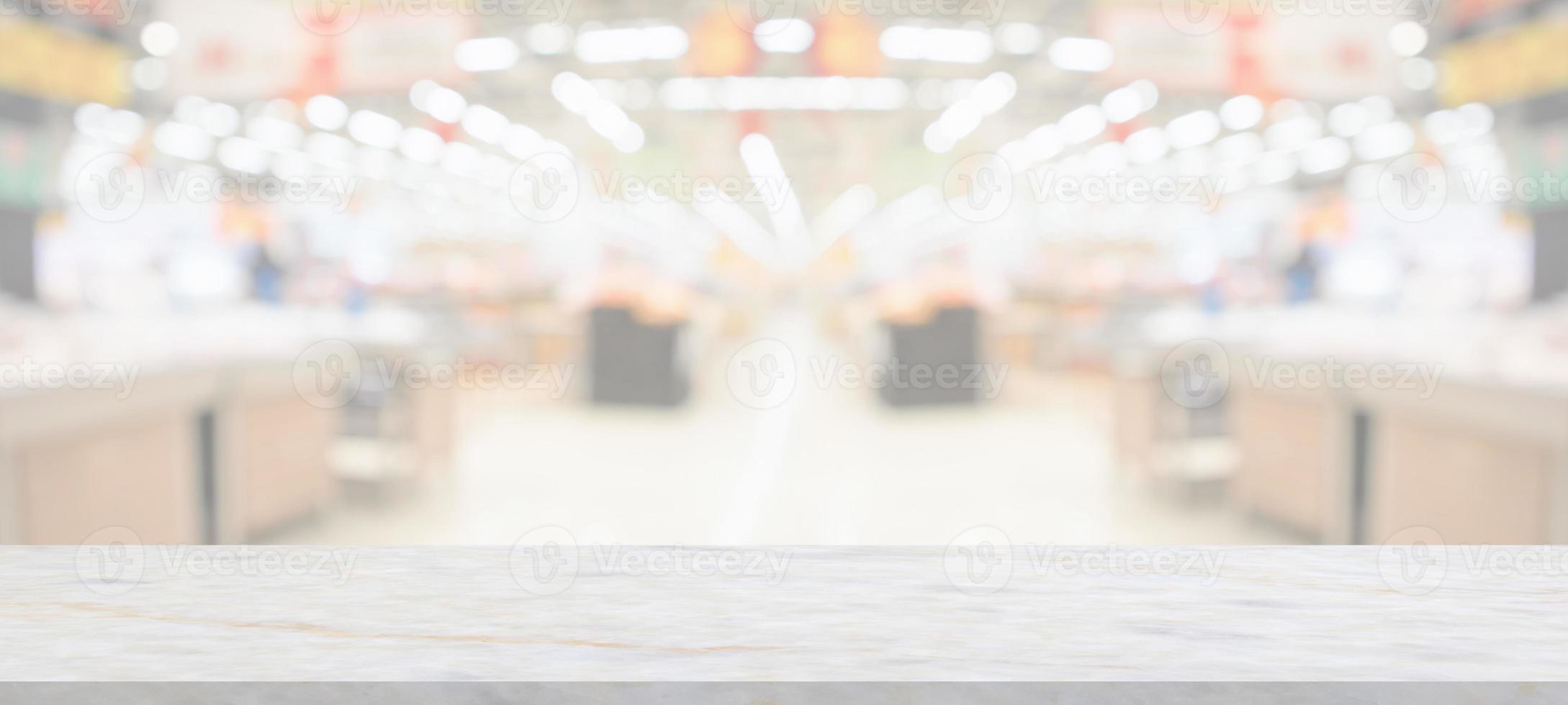 marble table top with supermarket grocery store blurred background with bokeh light for product display photo