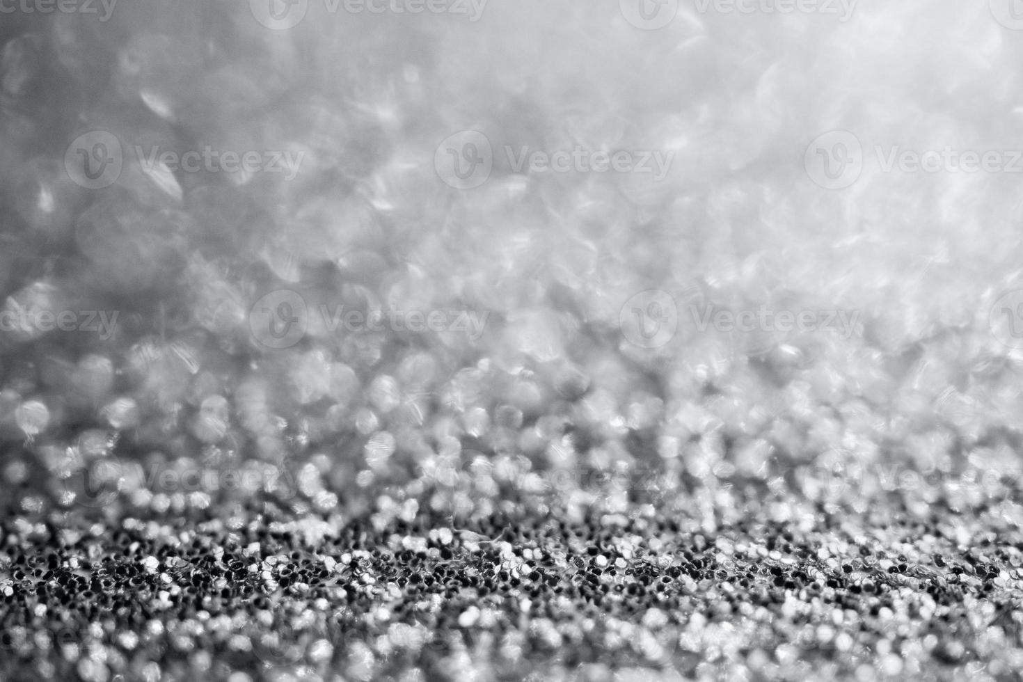 Abstract silver glitter sparkle texture with bokeh background photo