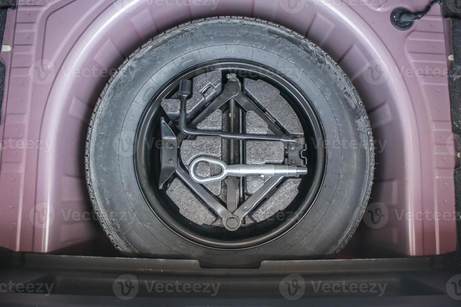 spare tire in the modern compact car photo