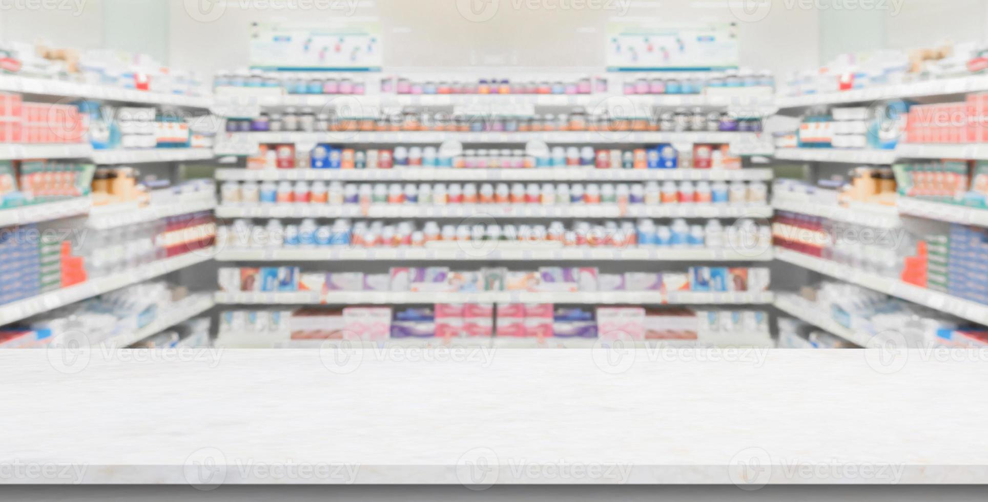 Empty white marble counter top with blur pharmacy drugstore shelves background photo