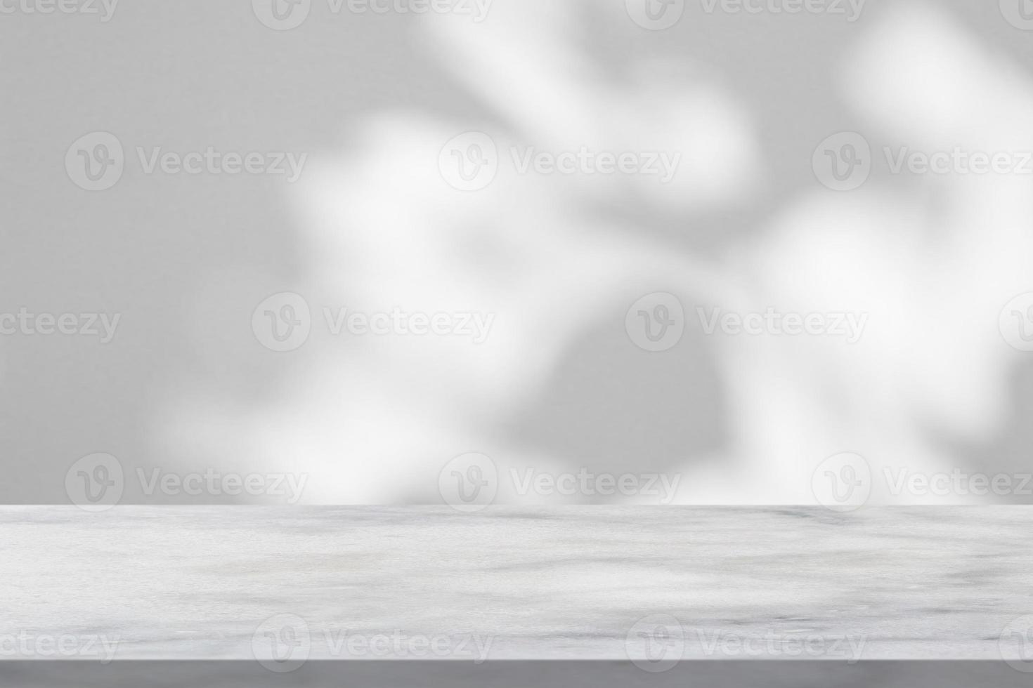 Marble table with tree shadow drop on white wall background for mockup product display photo