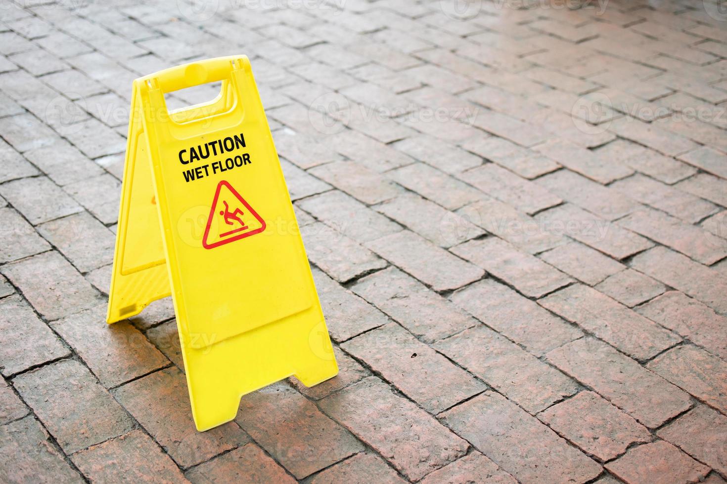 caution wet floor sign on the floor photo