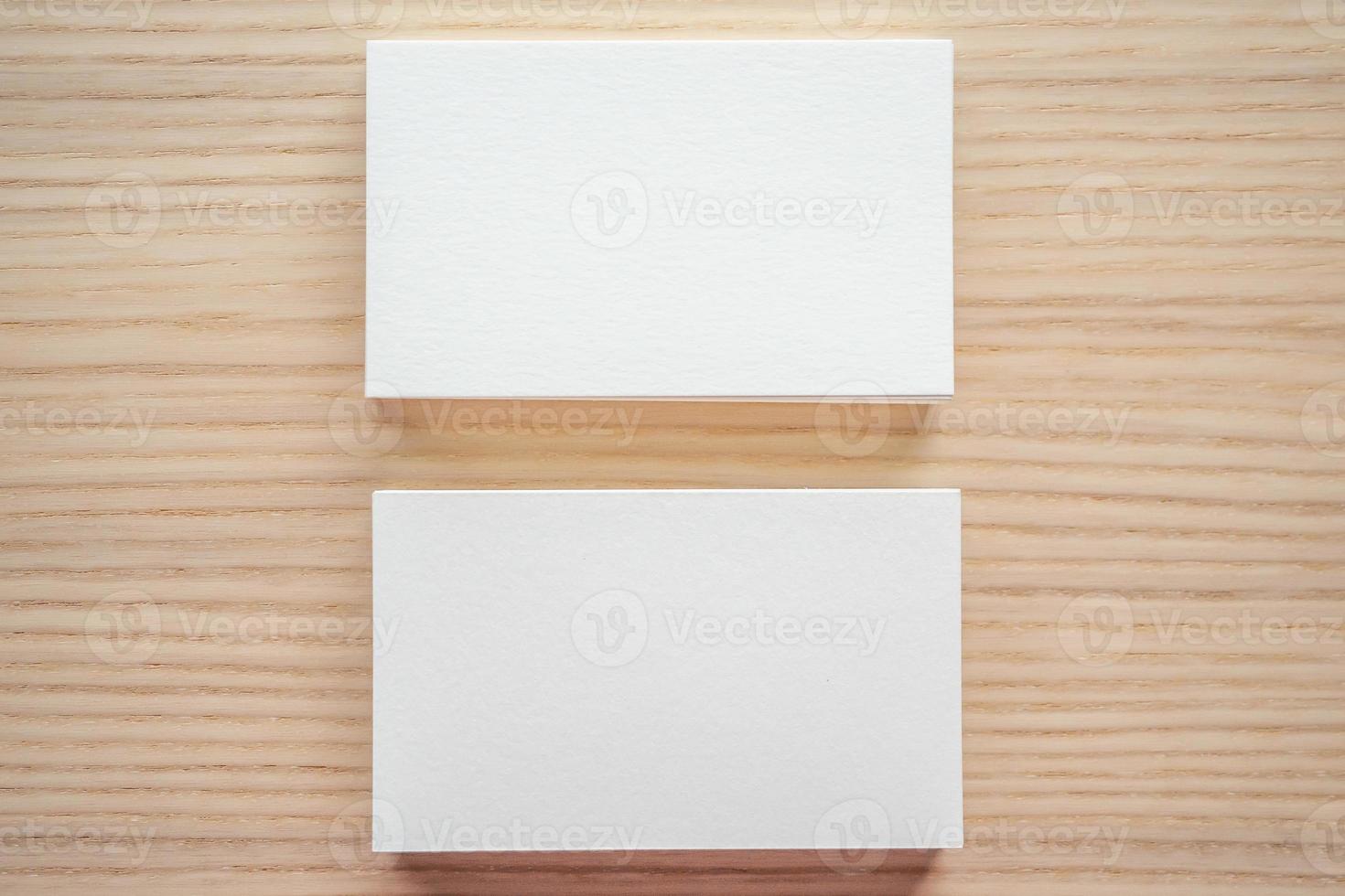 White business card on wood table background photo