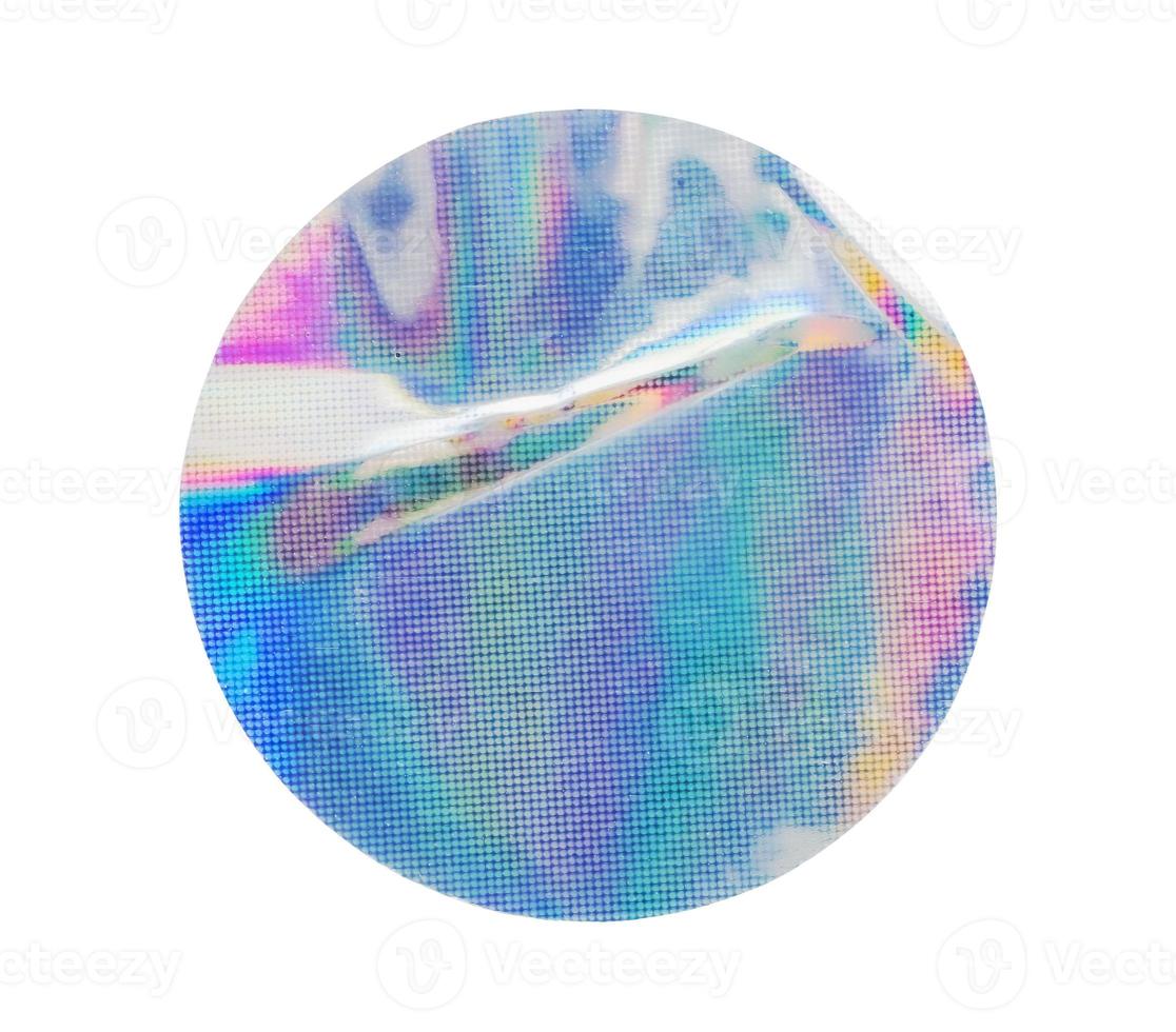 Blank round adhesive holographic foil sticker label isolated on white background photo