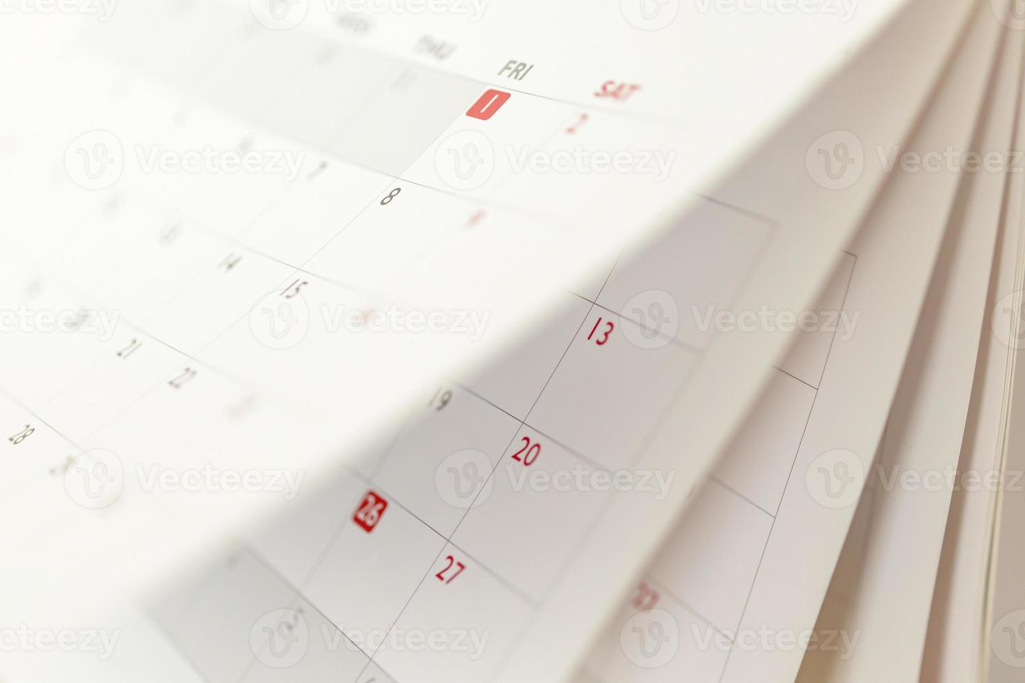 página del calendario hoja de volteo primer plano fondo borroso horario de negocios planificación cita reunión concepto foto