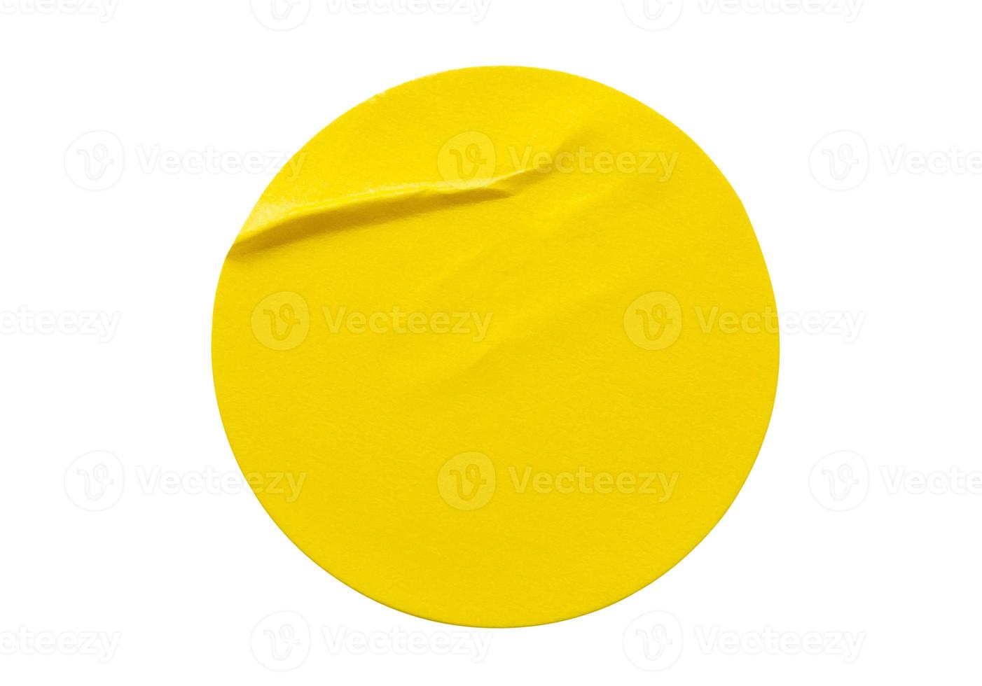 Yellow round paper sticker label isolated on white background photo