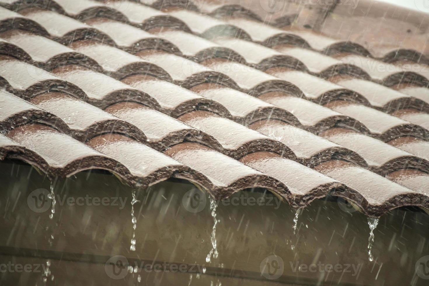 rain falling down from the house roof photo