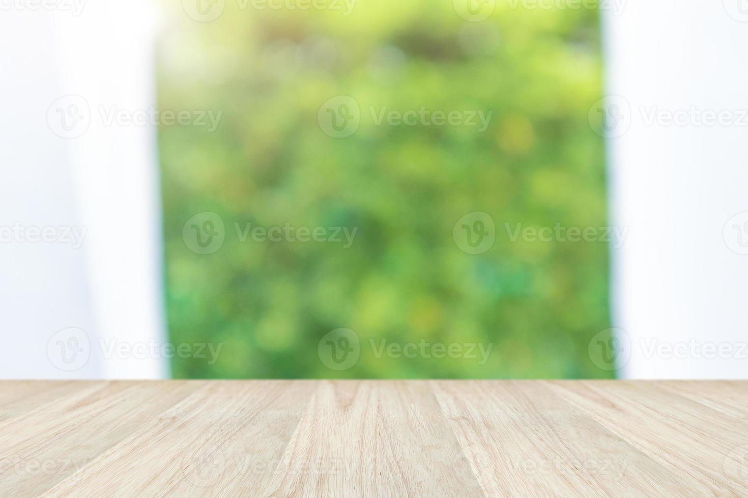 Empty wood table top with blur window curtain background for product display photo