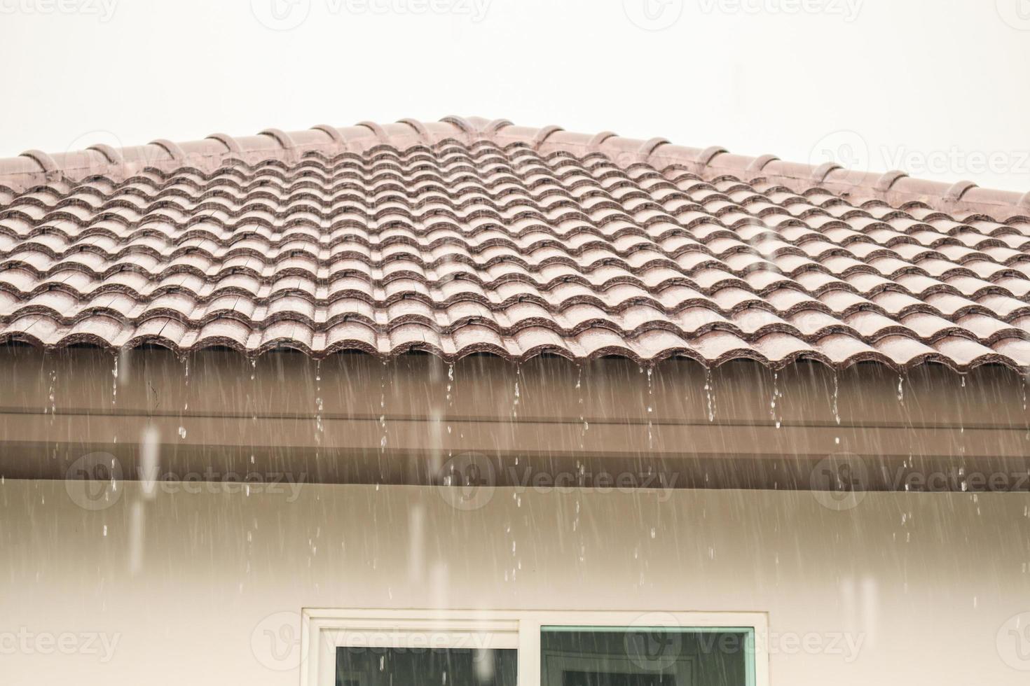 rain falling down from the house roof photo