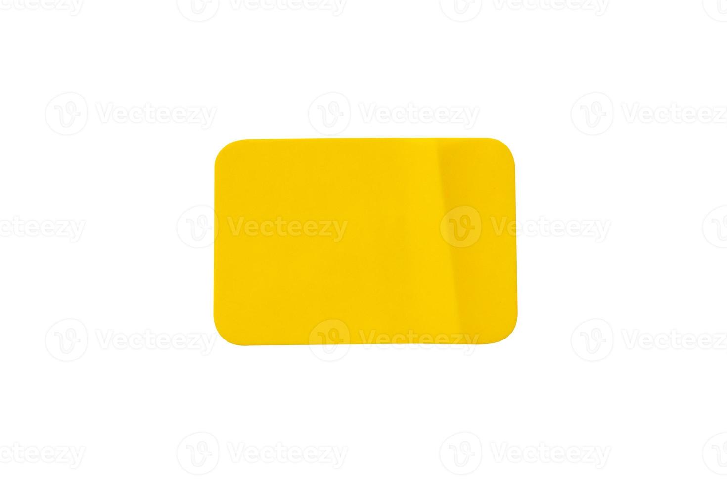 Yellow plastic sticker label isolated on white background photo