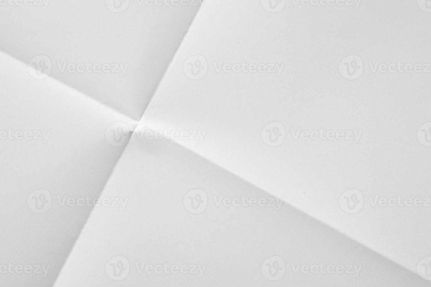 White folded and wrinkled paper texture background photo