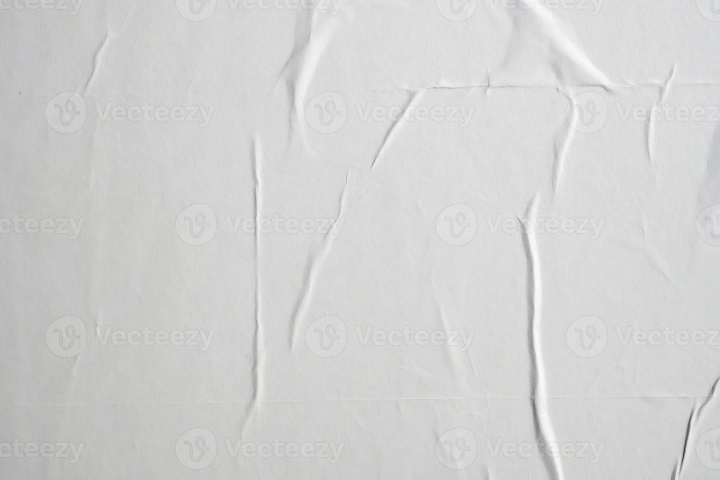 white crumpled and creased paper poster texture background photo