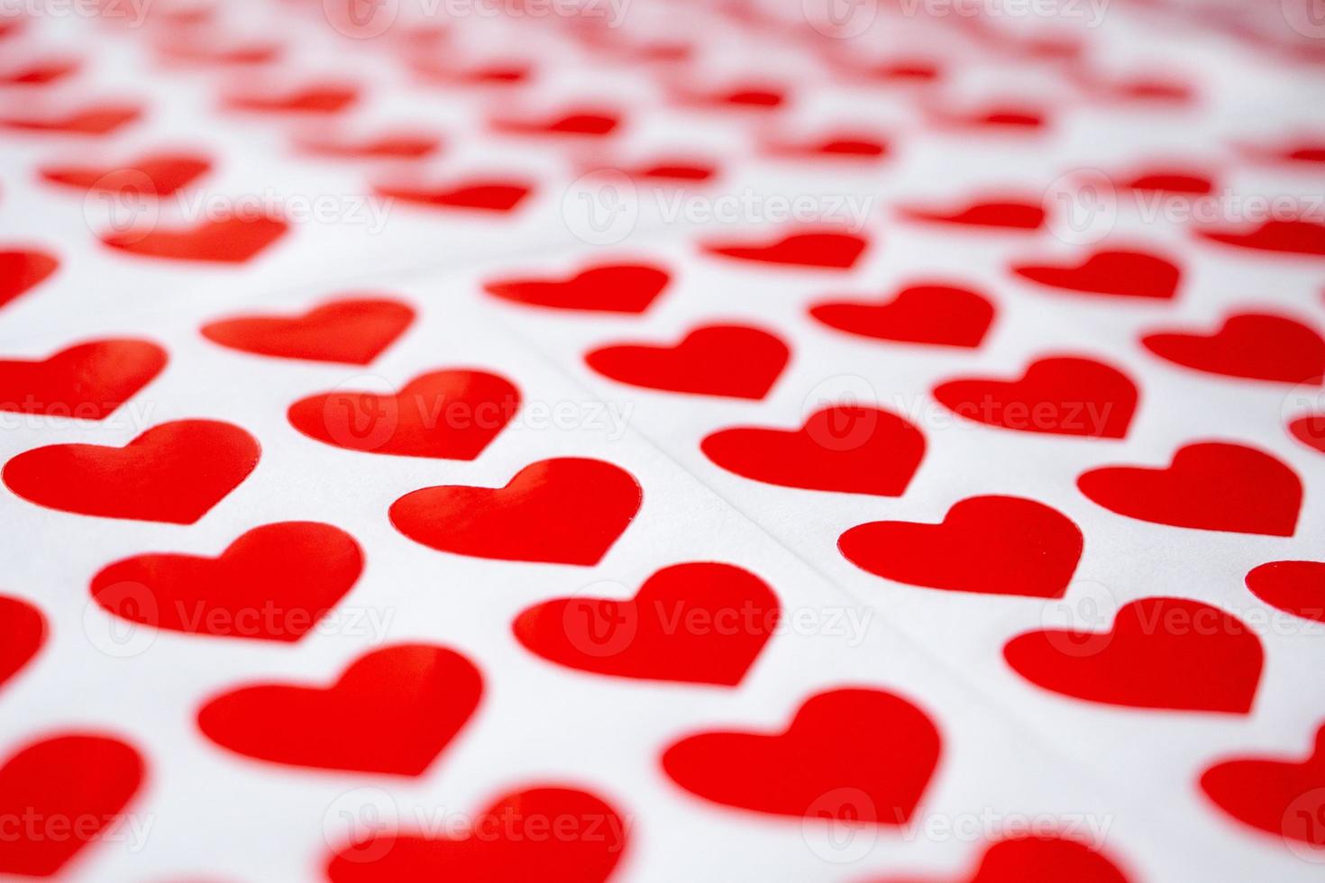 Close up red heart sticker on white paper photo
