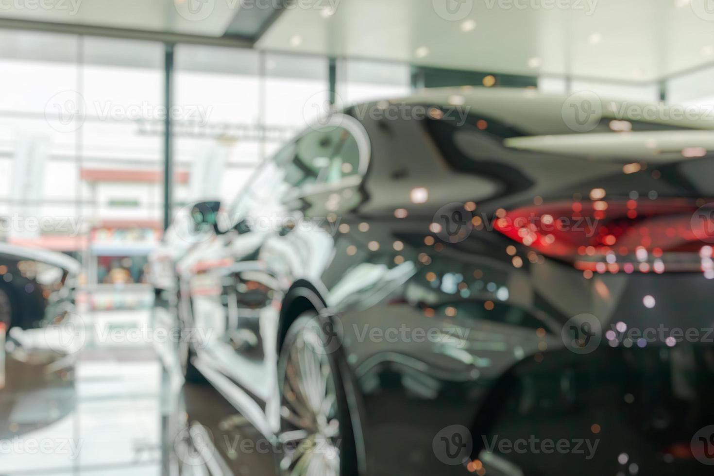 new cars in showroom interior blurred abstract background photo