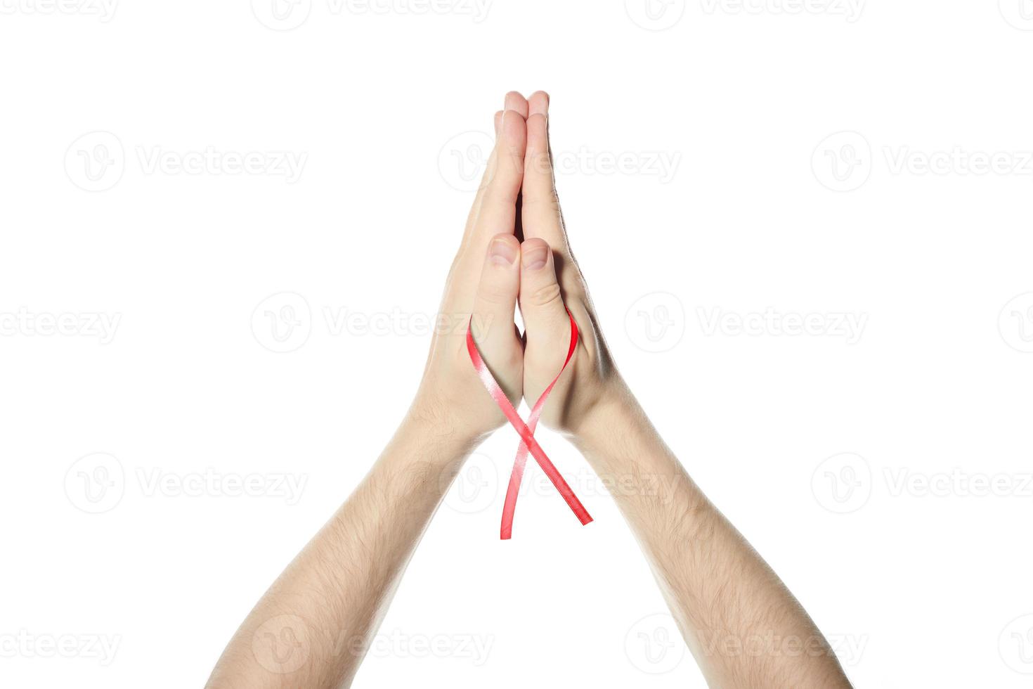 Red awareness ribbon in hand photo