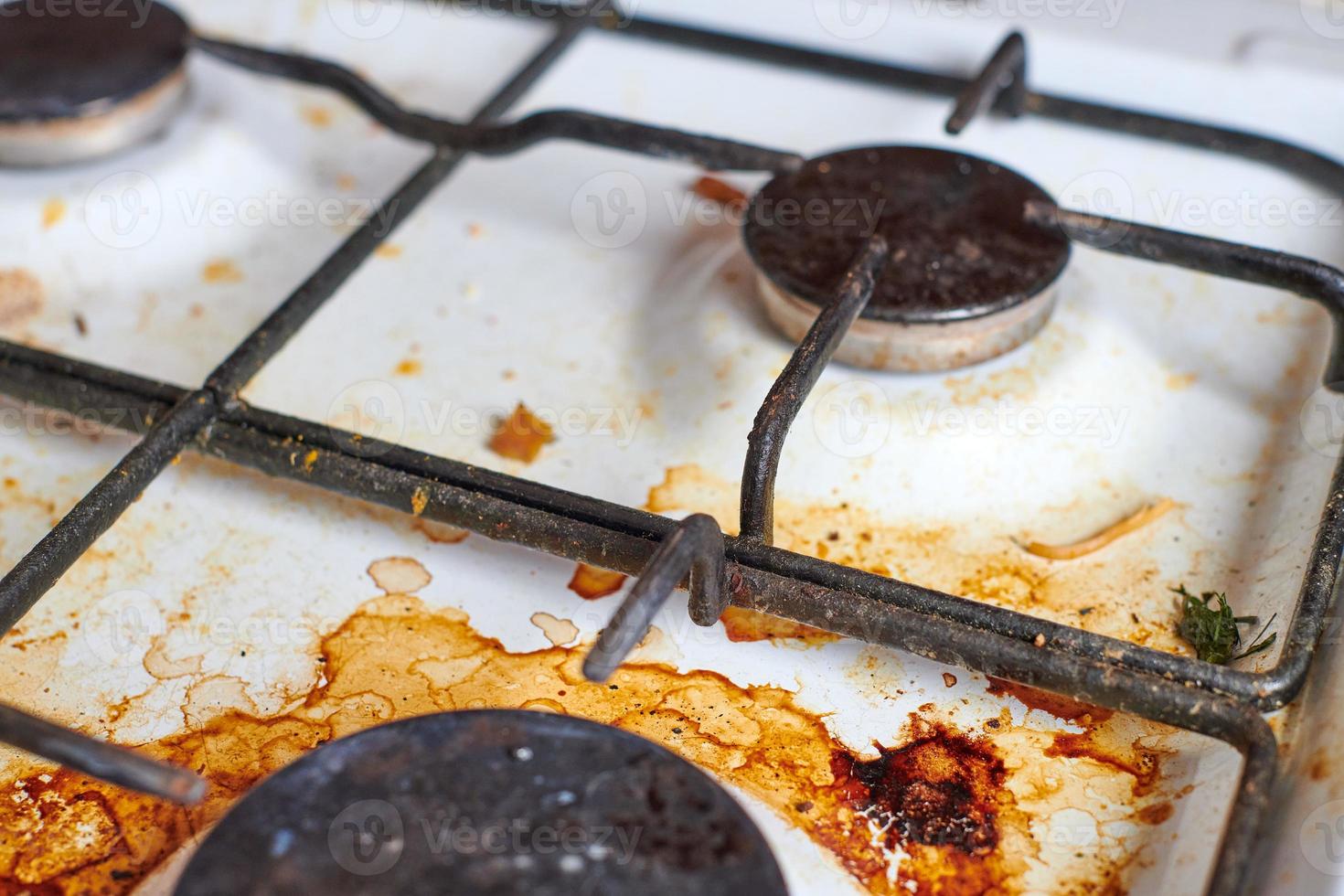 Dirty stove with food leftovers photo