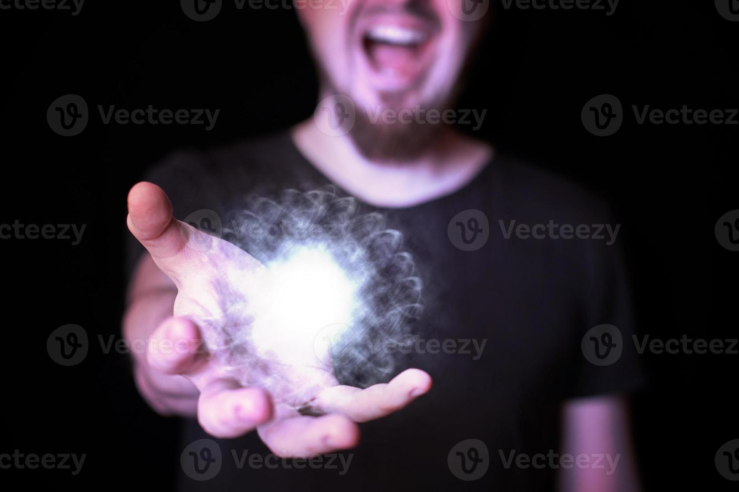 Magic ball in bearded wizard hand photo