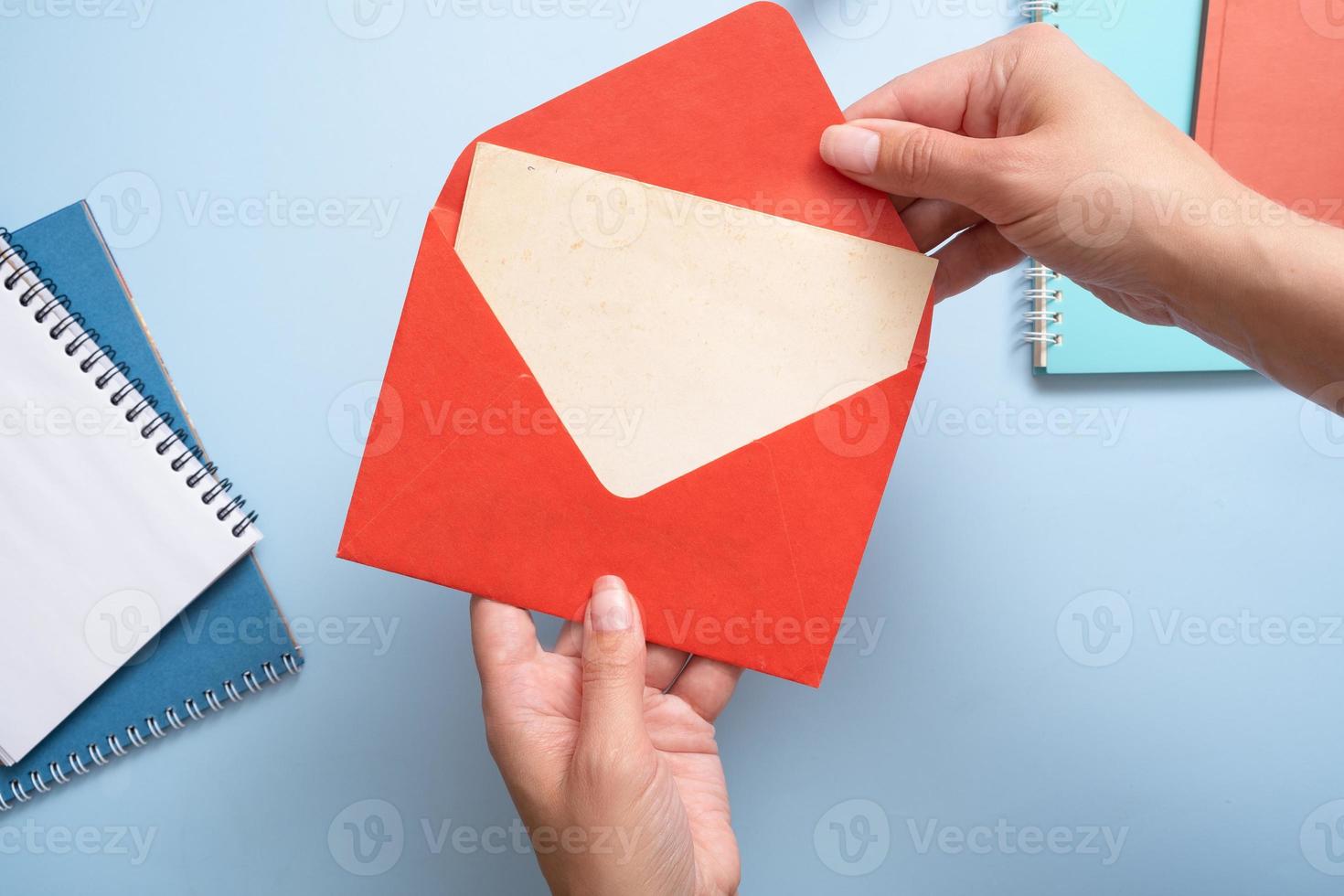 Blank Vitage sheet of paper woman hands take from the envelope. Business mock up concept photo