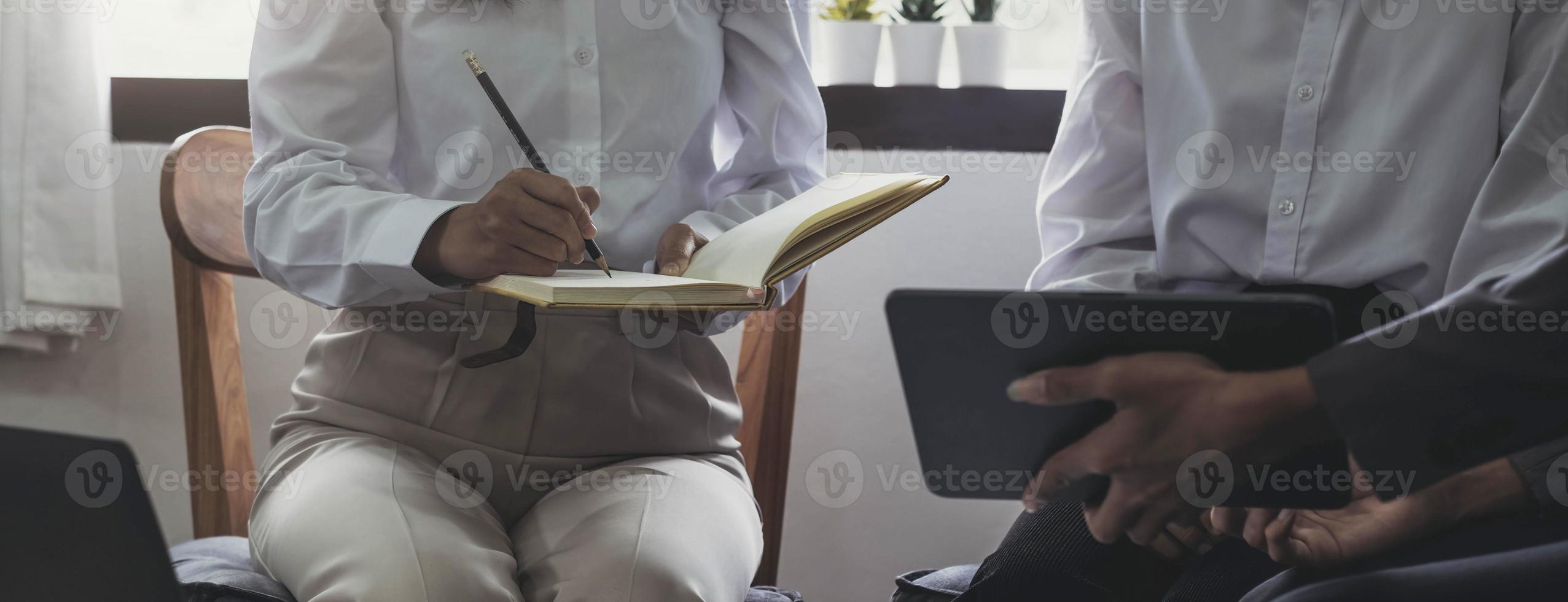 Fund managers team consultation and discuss about analysis Investment stock market by digital tablet photo