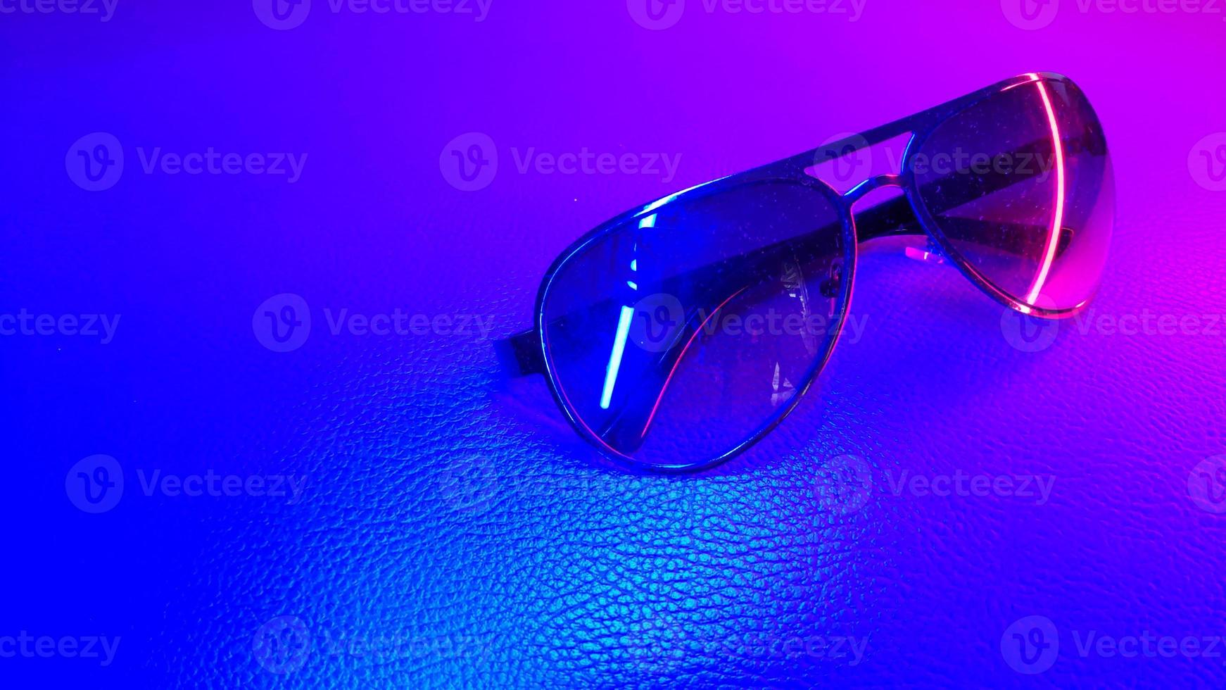 Sunglasses isolated color and light background photo
