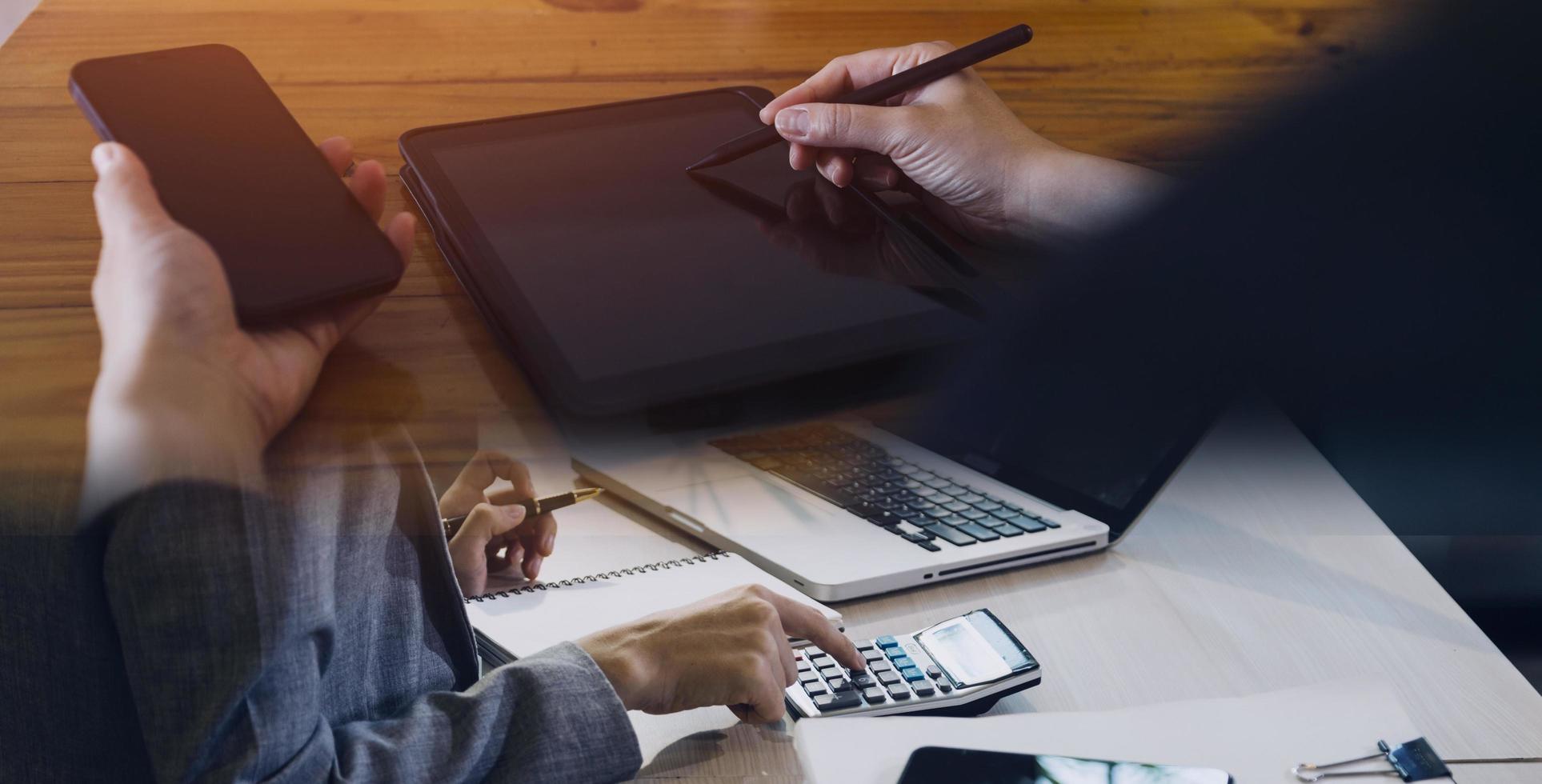 businesswoman hand working with laptop computer, tablet and smart phone in modern office with virtual icon diagram at modernoffice in morning light photo