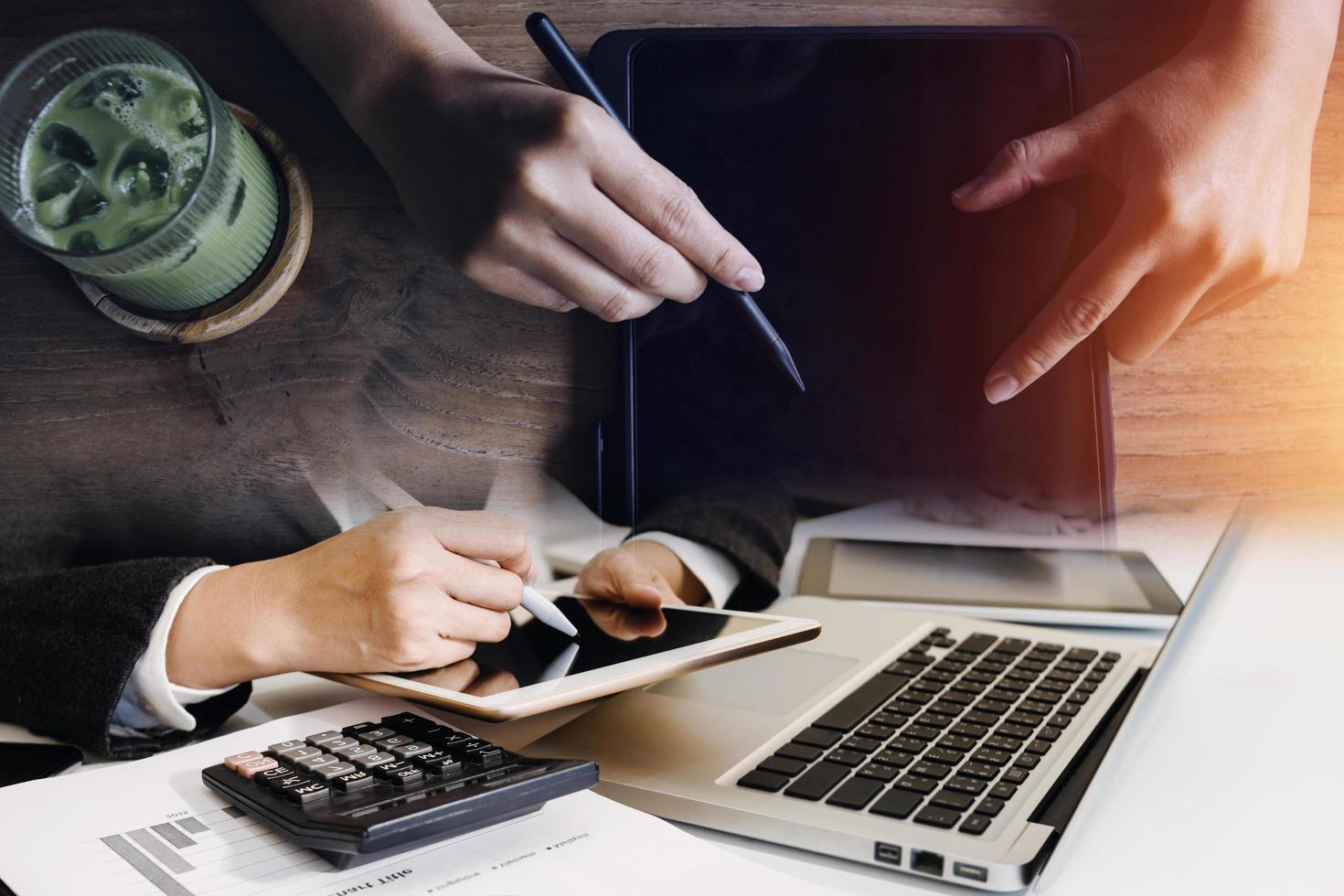 businesswoman hand working with laptop computer, tablet and smart phone in modern office with virtual icon diagram at modernoffice in morning light photo