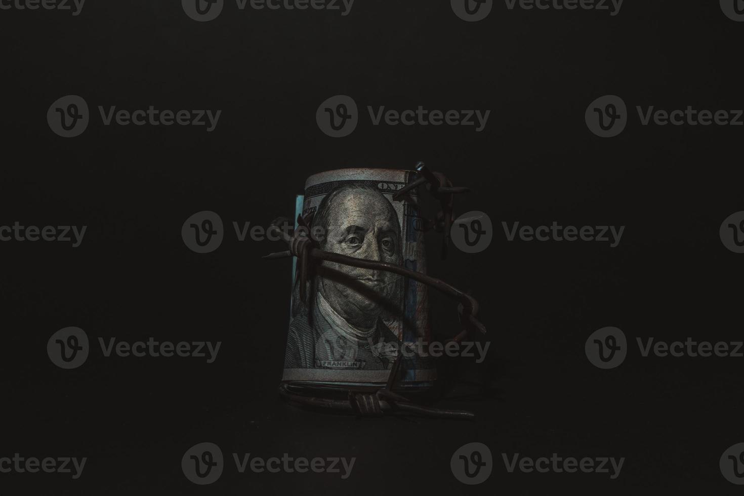 Dollar banknote with barbed wire, Economic crisis, background effect with little noise photo