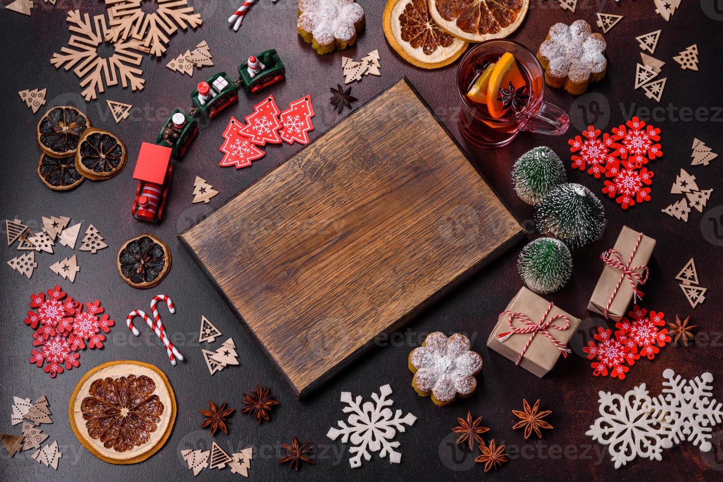 Hot mulled wine with a slice of orange, with cinnamon, cloves and other spices photo